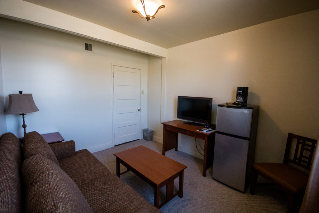 Remodeled Room Remodeled Room with television, refrigerator, couch and dining table